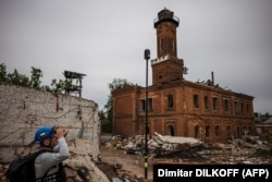 Поврежденное обстрелом здание пожарной станции, построенной в 1887 году в Харькове. Украина, 26 марта 2022 года