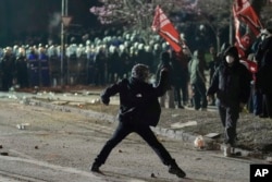 Protesters clash with riot police in Istanbul during a demonstration on March 22 against the arrest the city's mayor, Ekrem Imamoglu.