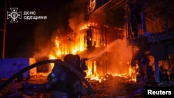 Firefighters work at the site of a Russian drone strike on Odesa on March 21. 